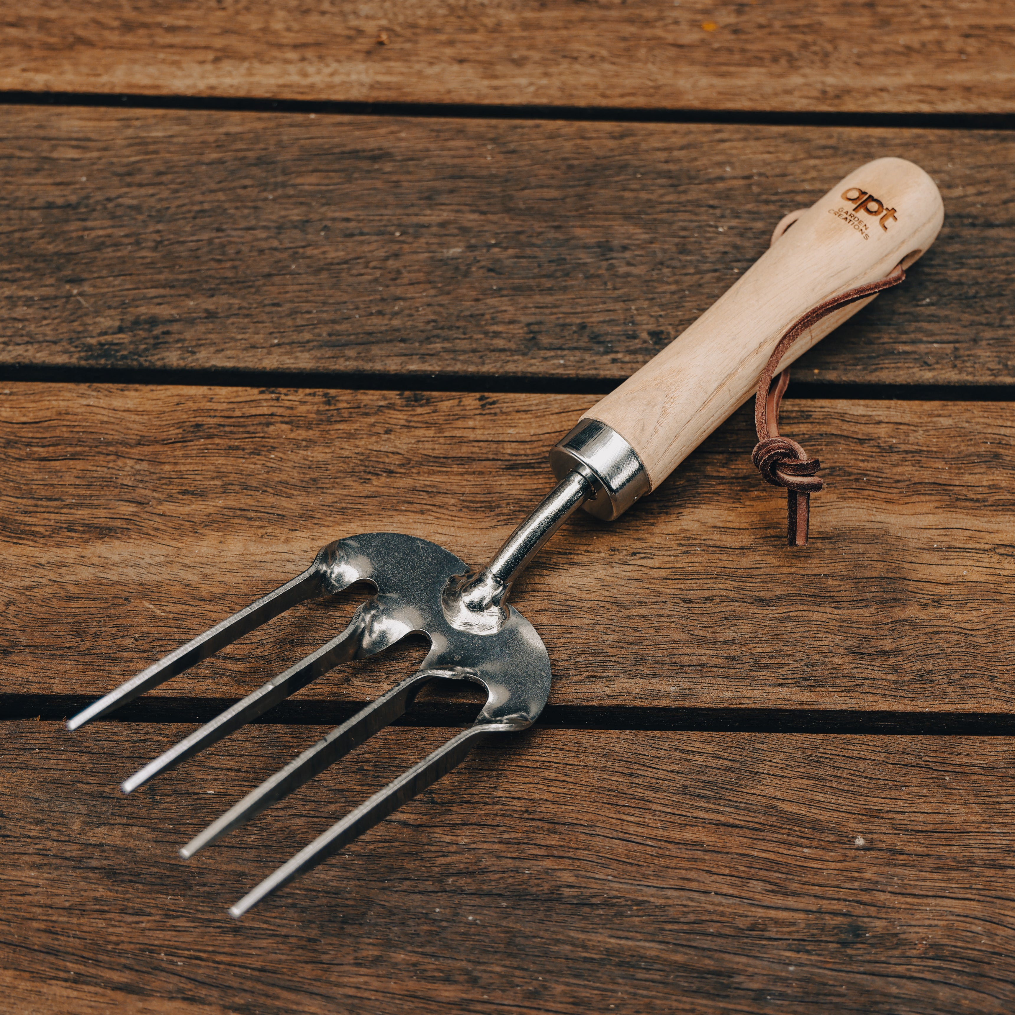 This stunning set of three garden tools, featuring ash-wood handles and stainless steel heads, a leather hang-strap and stylishly engraved with our Apt Garden Creations logo.